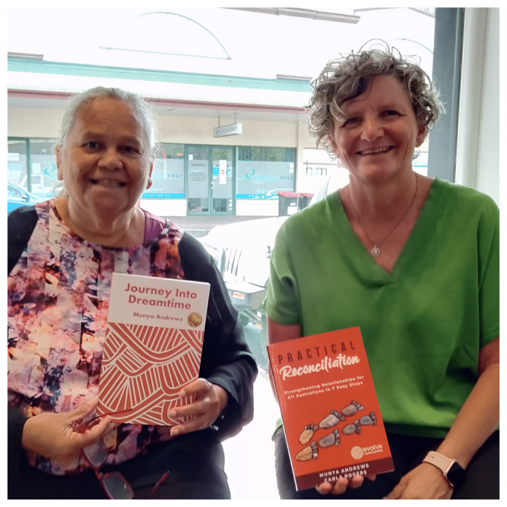 Picture of Aunty Munya Andrews holding her book, Journey Into Dreantime, and Carla Rogers holding the book Practical Reconciliation
