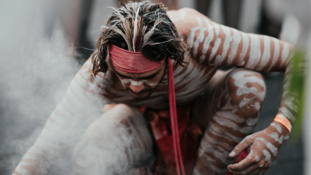 Aboriginal man performing a smoking ceremony