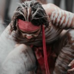 Aboriginal man performing a smoking ceremony