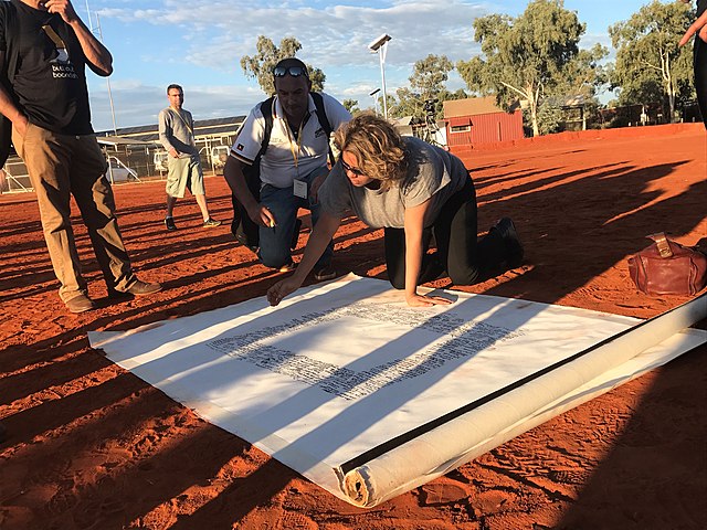 Denise Bowden, Yothu Yindi CEO, signing the Uluru statement