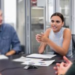 Indigenous woman leading a meeting at work