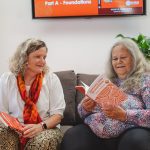 Carla and Aunty Munya with their books, Practical Reconciliation and Journey Into Dreamtime