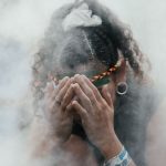 Hod did assimilation impact Indigenous Australians: Picture of a First Nations person practicing a traditional ceremony