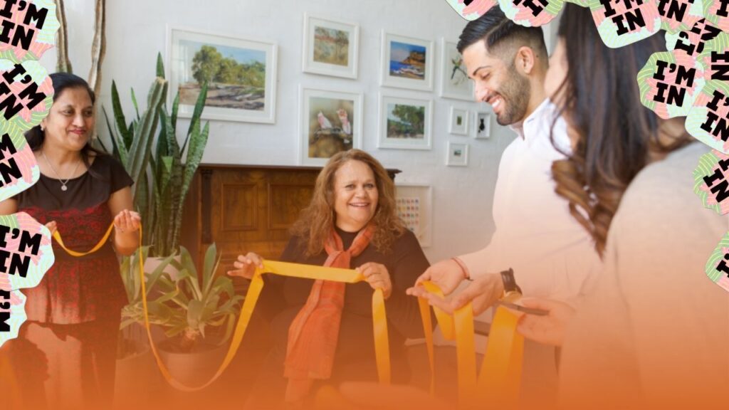 A team meeting discussing National Reconciliation Week activities.