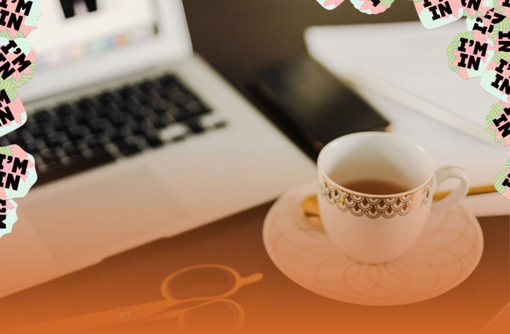 A cup of tea next to hands writing a Reconciliation Action Plan, symbolising the shift from a morning tea to practical action during National Reconciliation Week.